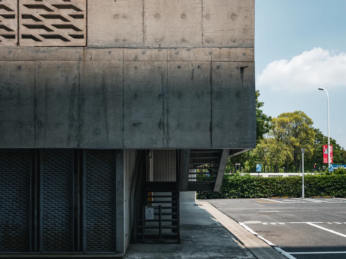 An open-air car park beside a building